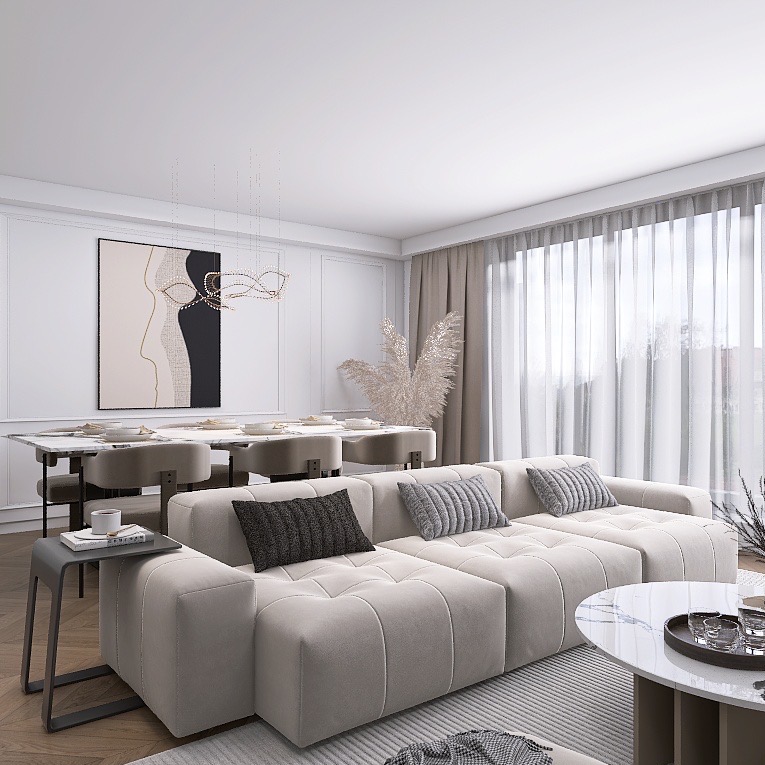 Jasny salon z modułową sofą, marmurowym stolikiem i minimalistyczną grafiką na ścianie. Krzesła z beżową tapicerką przy stole jadalnym. Subtelne zasłony wpadają do pomieszczenia.