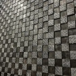 Ściana wykończona mozaiką z kwadratowych płytek w odcieniach szarości i czerni, niektóre z delikatnym wzorem, ułożonych pod kątem, z widocznymi refleksami światła.