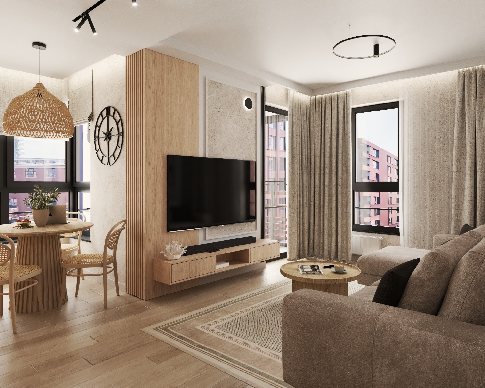 Jasne wnętrze salonu z jadalnią: drewniane panele, okrągły stół z wiklinowymi krzesłami, beżowa sofa i telewizor. Minimalistyczny design, naturalne materiały, duże okna.