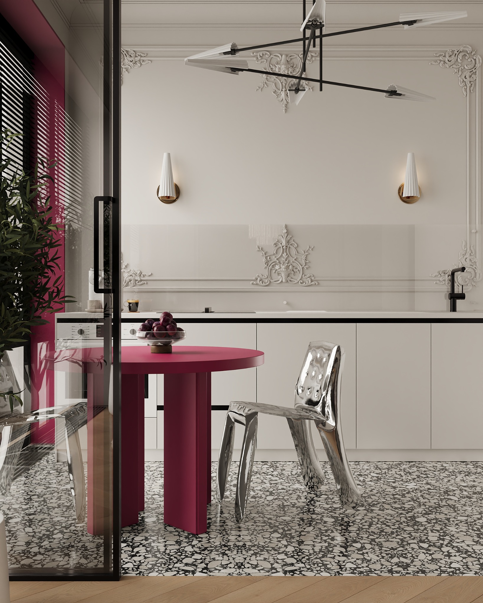 Nowoczesna aranżacja kuchni z okrągłym, różowym stołem, srebrnym krzesłem i dekoracyjnymi sztukateriami na ścianie. Widok przez przeszklone drzwi.