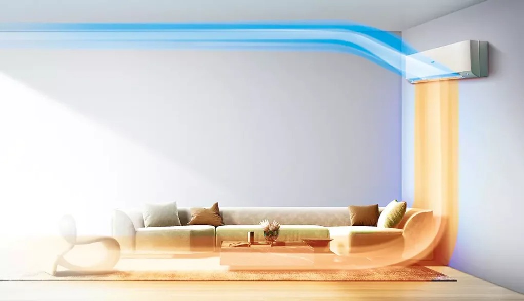 Nowoczesny klimatyzator ścienny w minimalistycznym salonie, z wizualizacją przepływu chłodnego (niebieski) i ciepłego (pomarańczowy) powietrza.