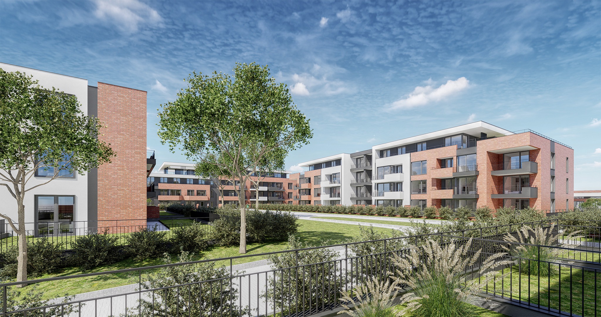 Wizualizacja osiedla budynków wielorodzinnych z ceglanymi i białymi elewacjami, balkonami i zielenią. Ujęcie z poziomu parteru, w tle błękitne niebo z chmurami.