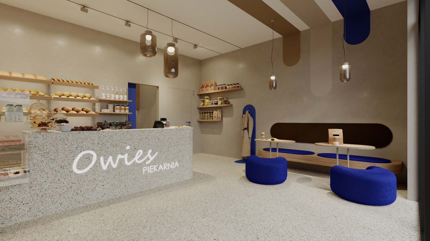 Wnętrze piekarni 'Owies' z ladą z lastryko, drewnianymi półkami z pieczywem i miejscami do siedzenia w kolorze granatowym. Minimalistyczny design z lampami wiszącymi.