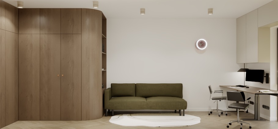 Nowoczesny pokój dzienny z biurkiem i sofą w odcieniach beżu i zieleni. Minimalistyczny design, okrągły zegar na ścianie, drewniana zabudowa meblowa.