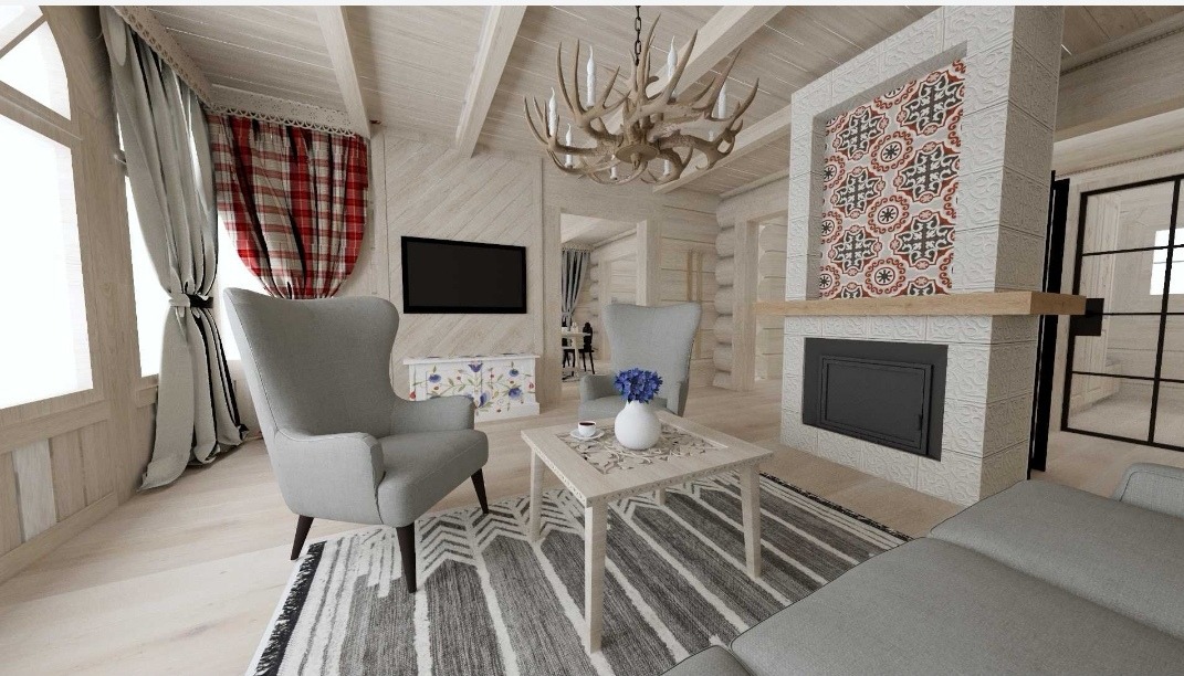Jasne wnętrze salonu w stylu rustykalnym z kominkiem obłożonym wzorzystymi płytkami, krzesłami z wysokim oparciem i żyrandolem z poroża, tworzące przytulną atmosferę.