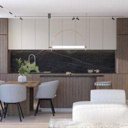 ZMYSŁ WNĘTRZA Architektura Roksana Simińska - Nowoczesna kuchnia z wyspą i marmurowym blatem, połączona z jadalnią. Drewniane fronty szafek i jasne ściany. Minimalistyczny design, oświetlenie punktowe.