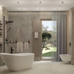 ZMYSŁ WNĘTRZA Architektura Roksana Simińska - Jasna łazienka z wolnostojącą wanną, szarą armaturą i widokiem na zieleń przez okno. Minimalistyczny design z akcentami drewna i kamienia.