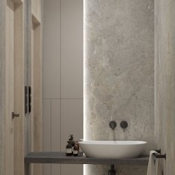 ZMYSŁ WNĘTRZA Architektura Roksana Simińska - Nowoczesna łazienka z umywalką nablatową, marmurową ścianą i subtelnym oświetleniem LED. Minimalistyczny design z drewnianymi akcentami i czarną armaturą.