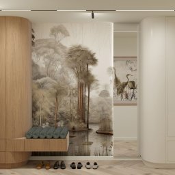 ZMYSŁ WNĘTRZA Architektura Roksana Simińska - Nowoczesna szafa wnękowa z siedziskiem i tapetą z motywem leśnym. Jasne drewno i biel tworzą spójną całość. Na podłodze poukładane buty.