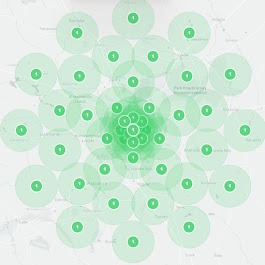 Mapa z zaznaczonymi punktami w okręgach, wskazująca zasięg lokalny lub obszar działania firmy, w odcieniach zieleni na jasnym tle mapy.