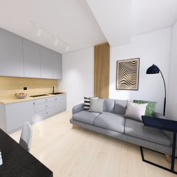 ARBUD TOMASZ PUŃKO - Jasne wnętrze: szara zabudowa kuchenna z drewnianym panelem, szara sofa z poduszkami, plakat Bauhaus i czarny stolik. Nowoczesny minimalizm w aranżacji.