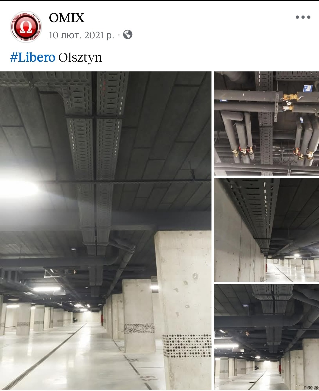 Szare koryta kablowe pod sufitem parkingu podziemnego, widoczne rury i kolumny. Oświetlenie sufitowe. Ujęcie z perspektywy podłogi, widok na instalacje.