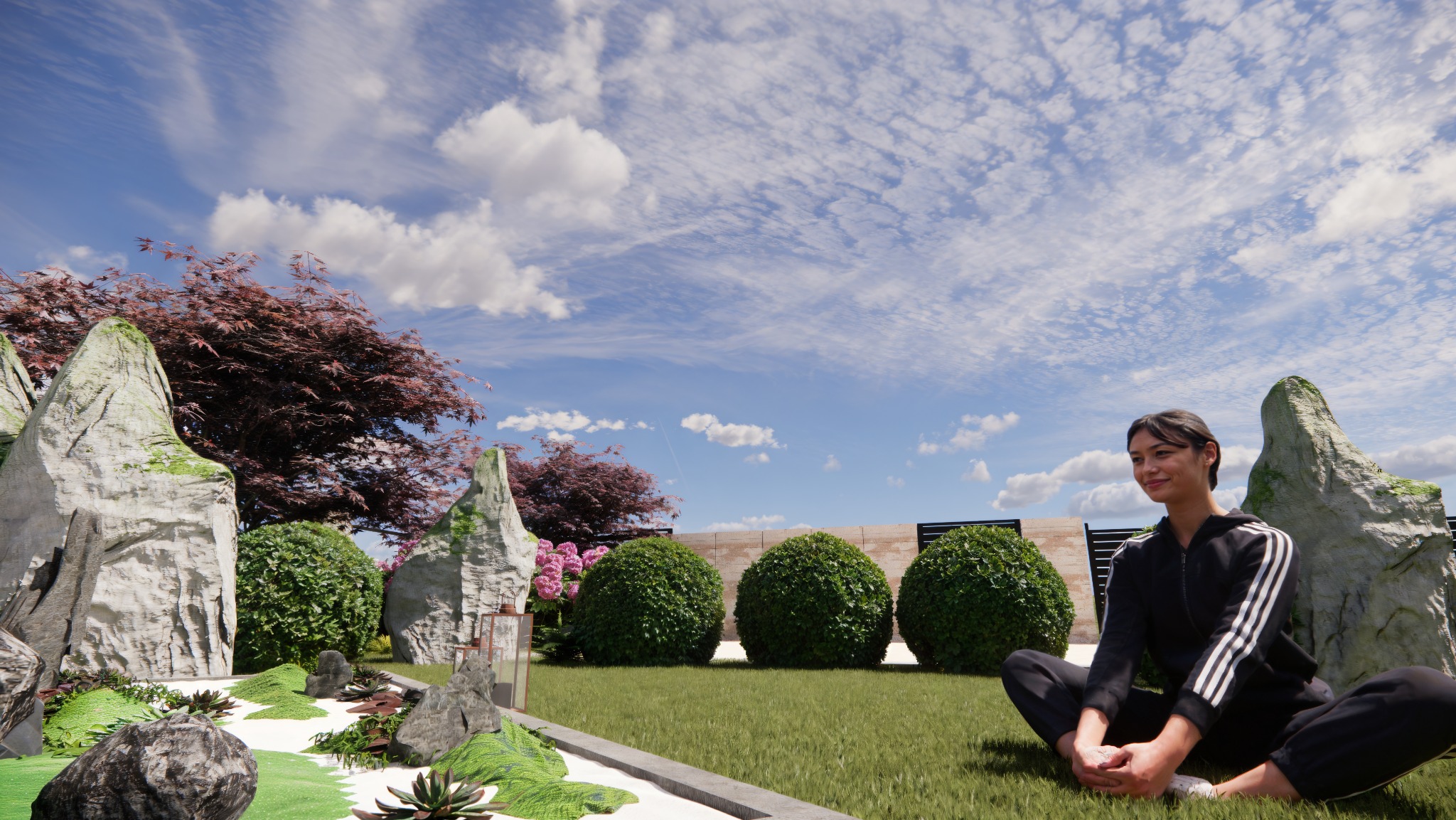 Ogród w stylu ZEN z dużymi kamieniami, kulistymi krzewami i drzewami o czerwonych liściach. Kobieta siedzi na trawie w pozycji lotosu. Błękitne niebo z chmurami w tle.