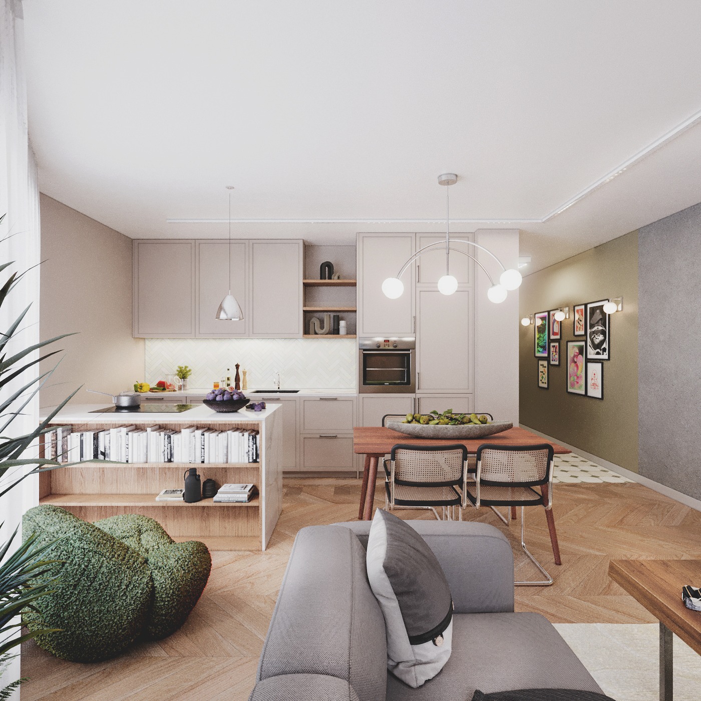 Jasna kuchnia z wyspą i regałem na książki, połączona z jadalnią. W tle galeria obrazów na ścianie. Nowoczesne oświetlenie i drewniana podłoga w jodełkę.