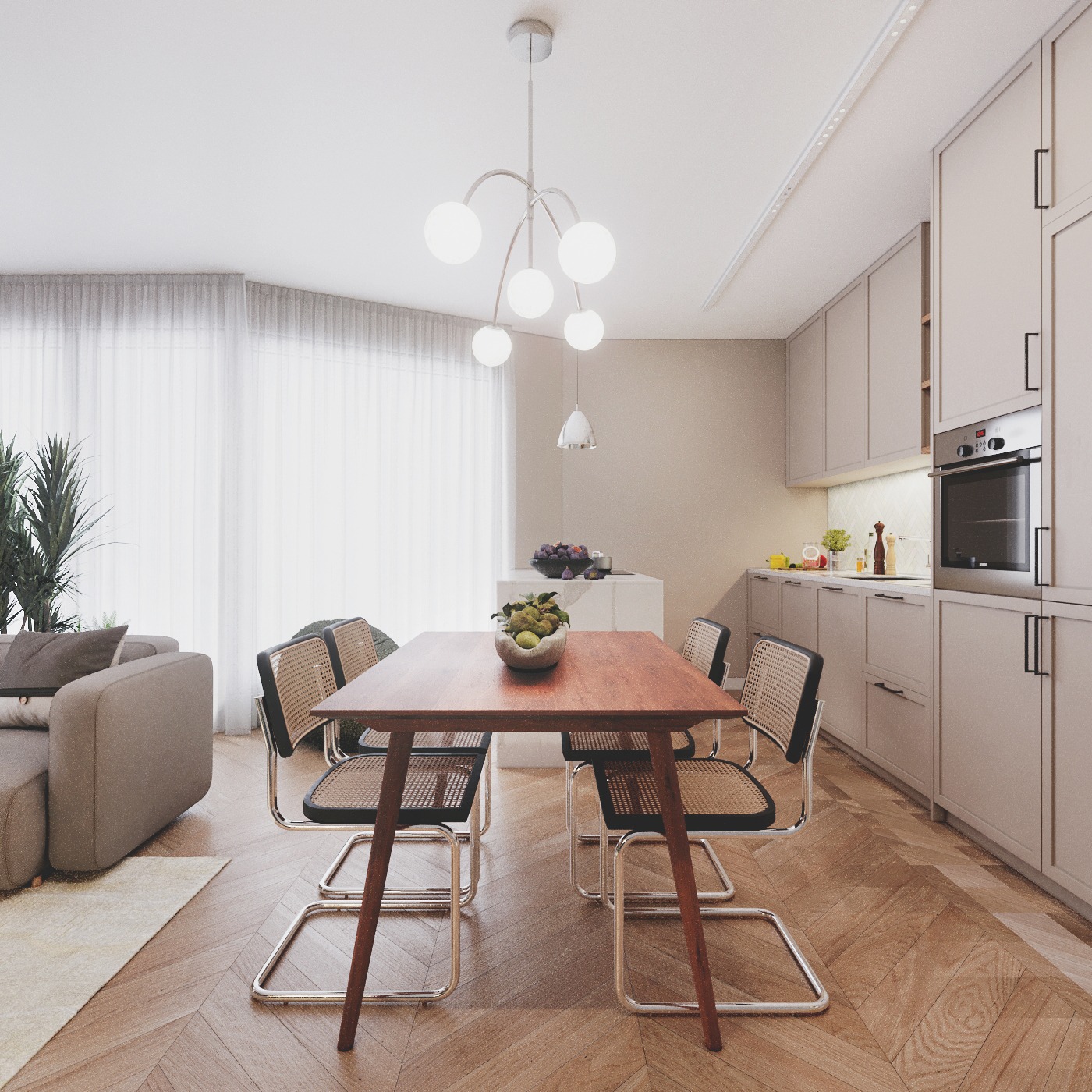 Jasne wnętrze: drewniany stół z owocami, krzesła z rattanowym oparciem, szara sofa i kuchnia w tle. Parkiet w jodełkę, naturalne światło przez okno.