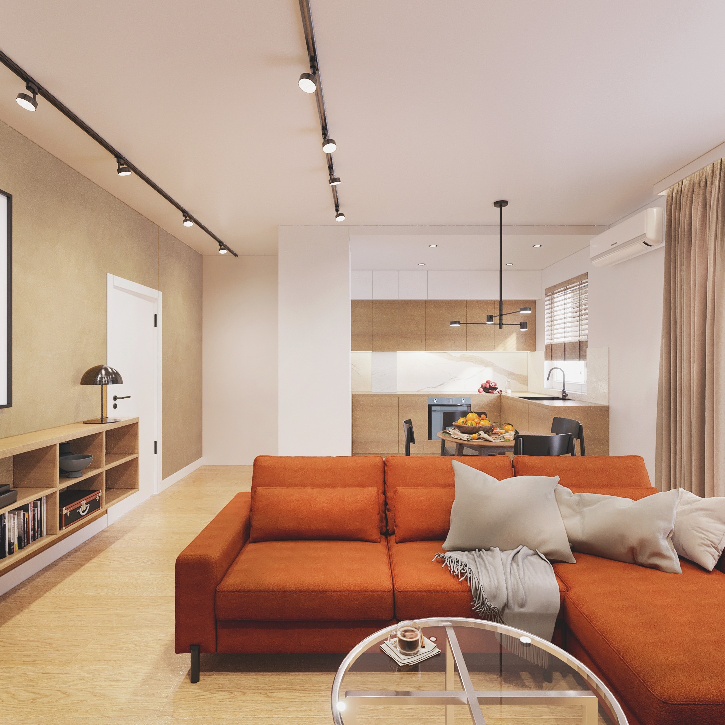 Nowoczesny salon z otwartą kuchnią. Pomarańczowa sofa narożna, szklany stolik kawowy, drewniane podłogi i oświetlenie szynowe. Minimalistyczny design.