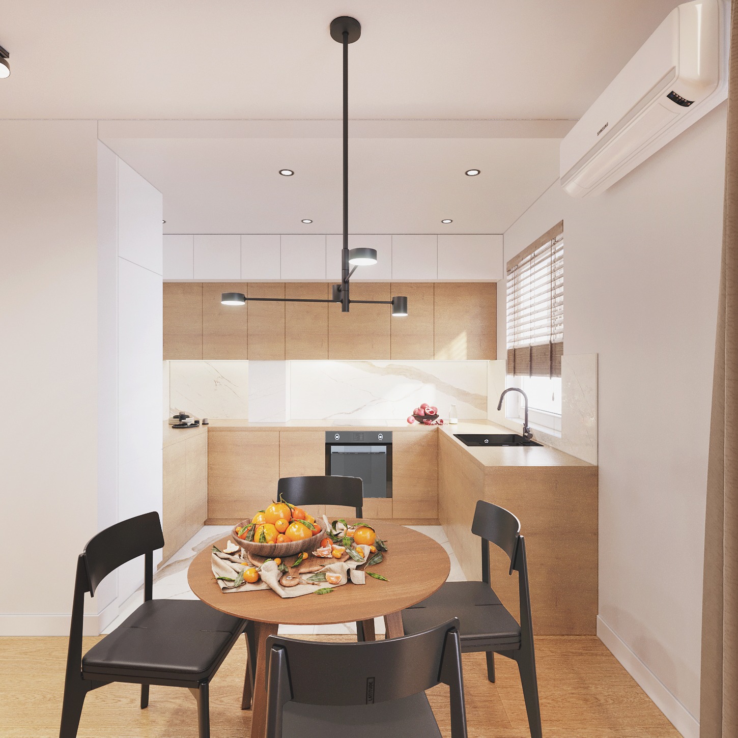 Nowoczesna aranżacja kuchni we Wrocławiu z okrągłym stołem i owocami. Jasne drewno, marmur i minimalistyczne oświetlenie tworzą elegancką przestrzeń.