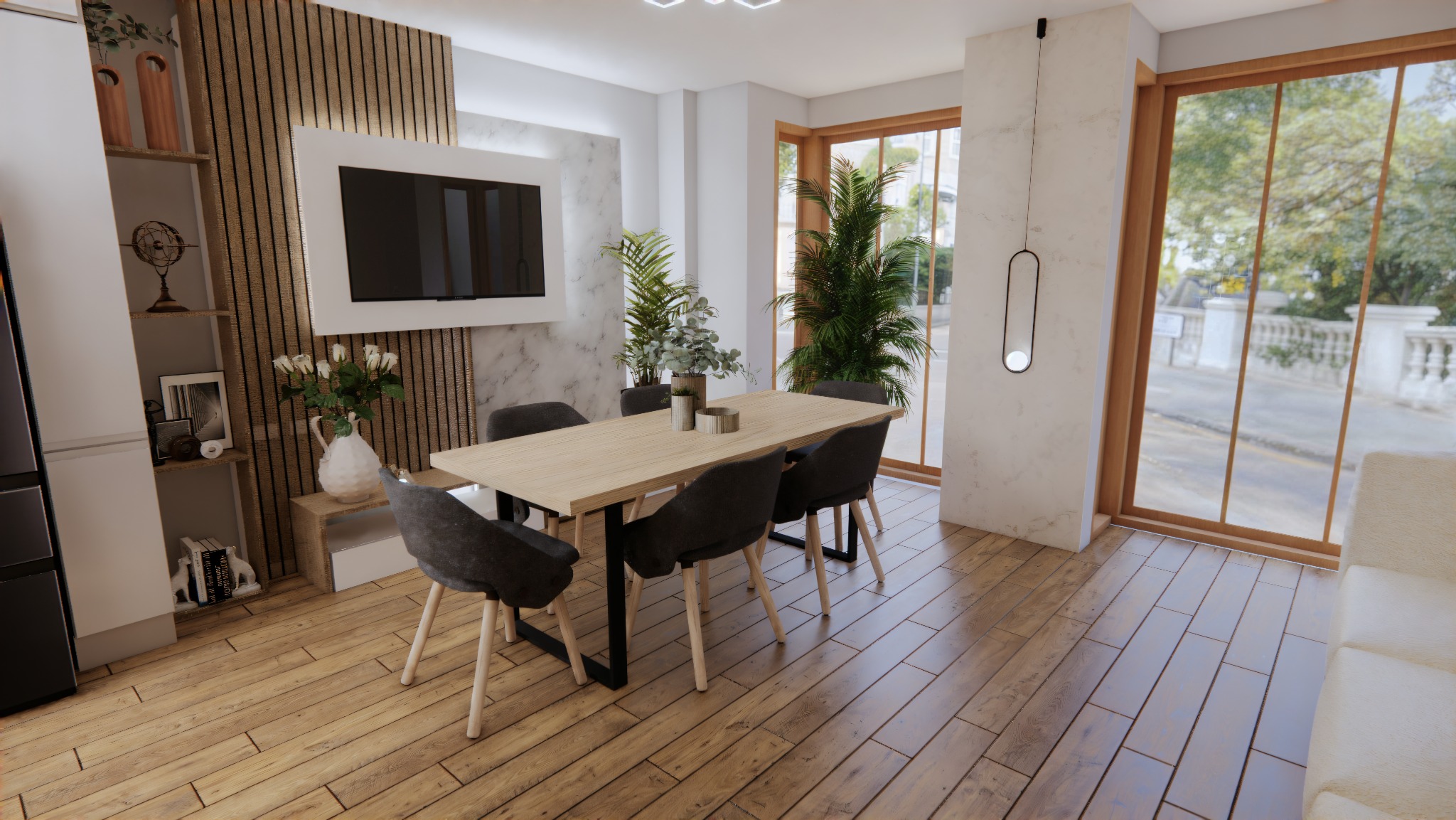 Jasna jadalnia z drewnianą podłogą i stołem otoczonym szarymi krzesłami. W tle okno z widokiem na zieleń i telewizor na ścianie z marmurowym wzorem.