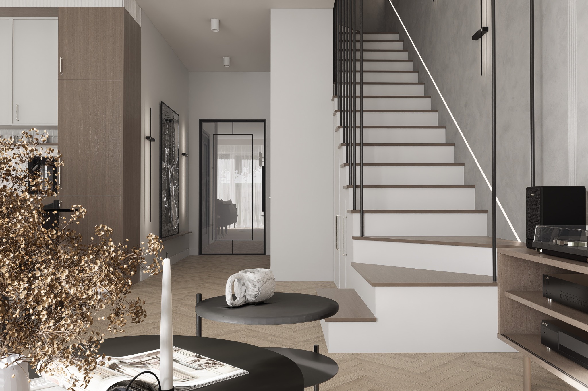 Nowoczesne wnętrze domu z drewnianą podłogą w jodełkę, schodami z czarną balustradą i minimalistycznym stolikiem kawowym z dekoracją. Stonowana kolorystyka.