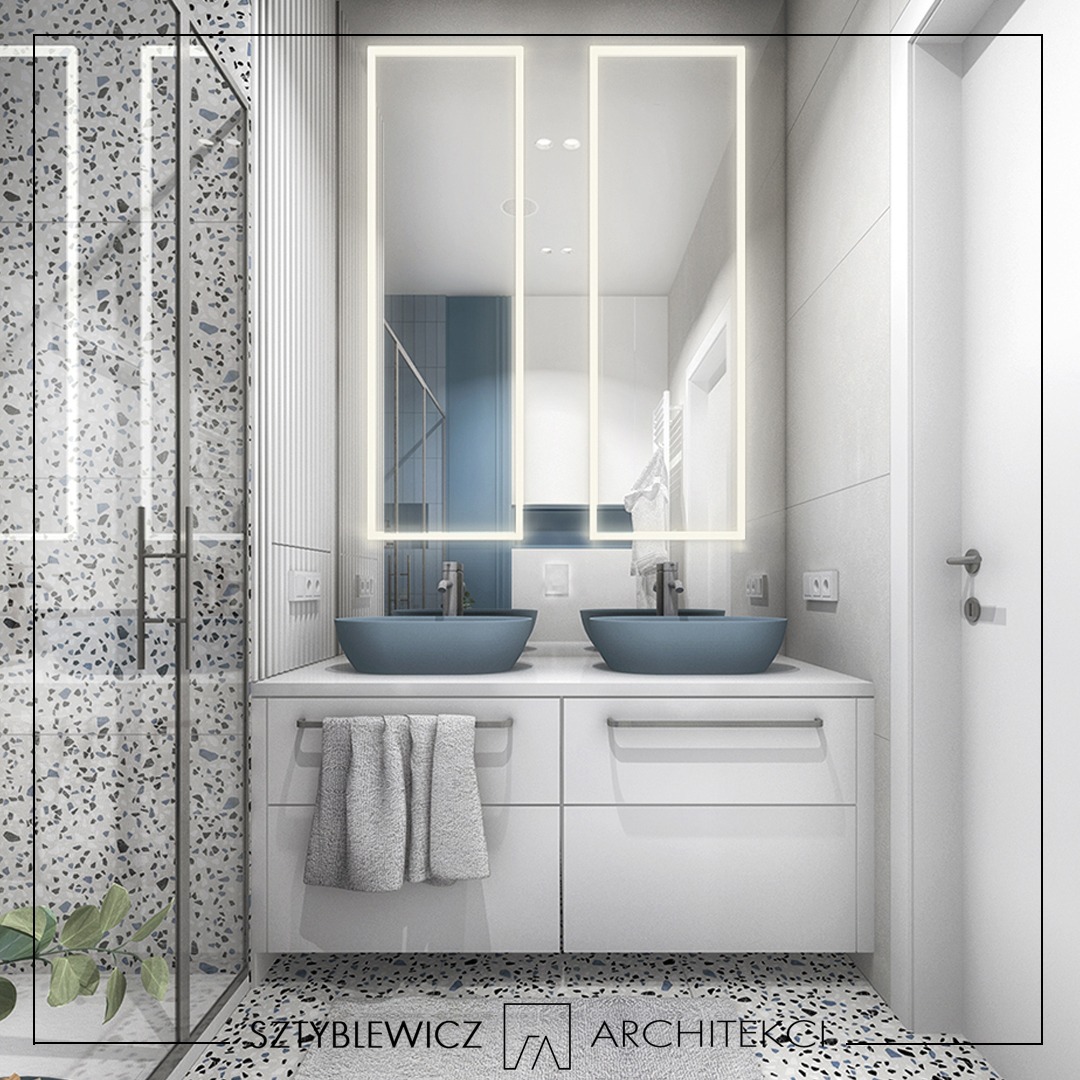 Nowoczesna łazienka z podwójną umywalką w odcieniach błękitu, białą szafką i lustrem z podświetleniem LED. Kabina prysznicowa z mozaiką.