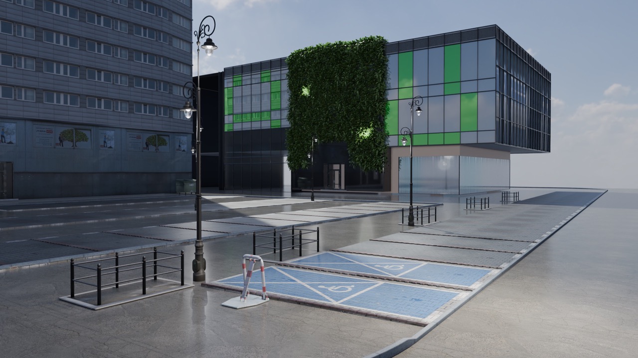 Nowoczesny budynek biurowy z zieloną ścianą i szklaną fasadą, widoczny z perspektywy ulicy z miejscami parkingowymi dla niepełnosprawnych i stylizowanymi latarniami.