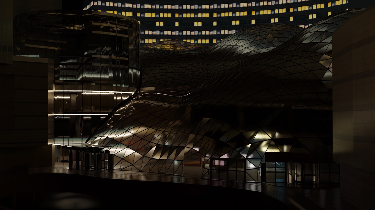 Nocne ujęcie nowoczesnej architektury budynku z metalową, trójkątną elewacją i cylindryczną wieżą, oświetlonego ciepłym światłem, na tle wieżowca z licznymi oknami.