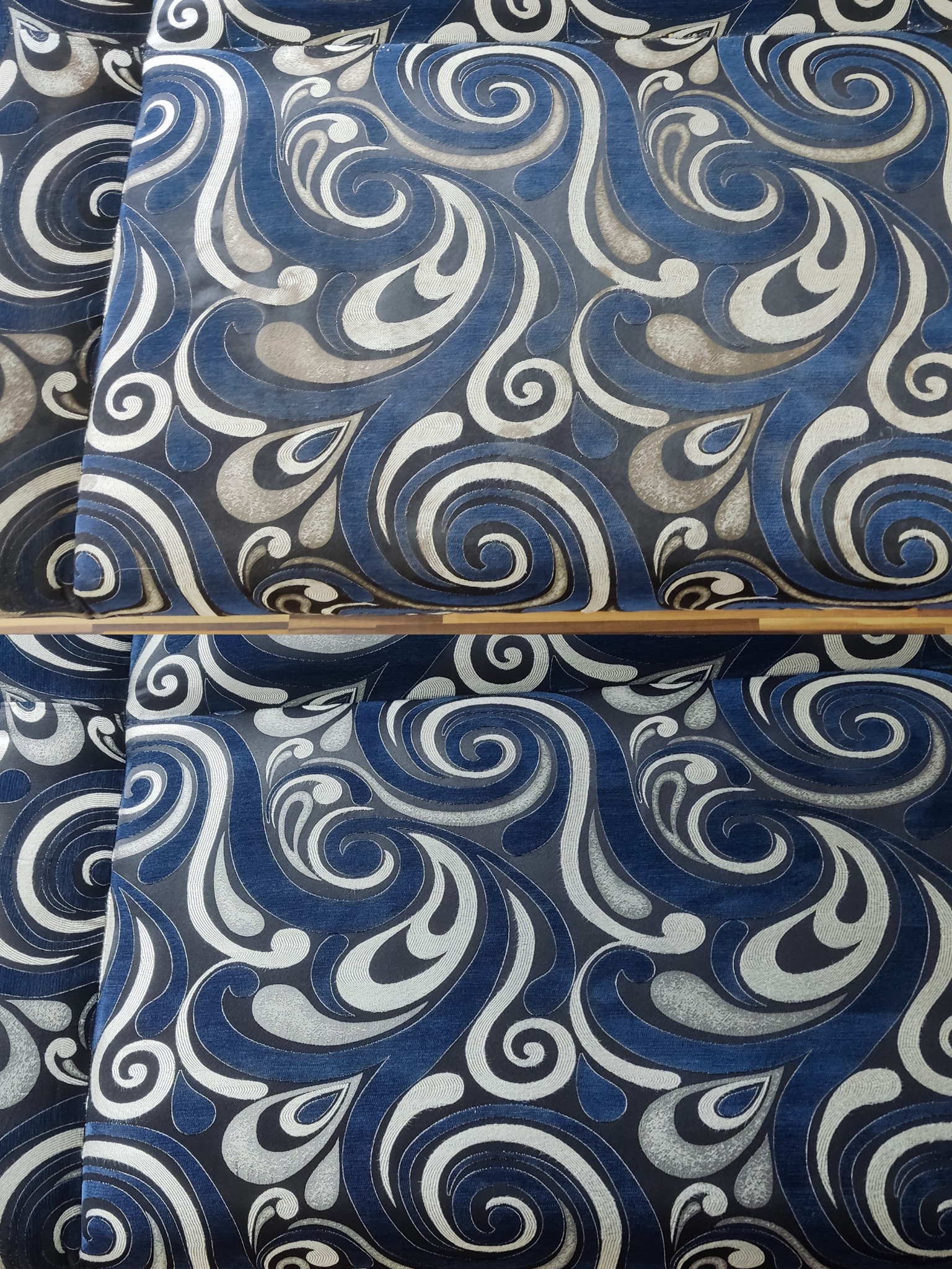 Fragment wyczyszczonej kanapy z wzorem w odcieniach błękitu, szarości i bieli. Widoczne detale wzoru i struktura materiału po zabiegu czyszczenia.