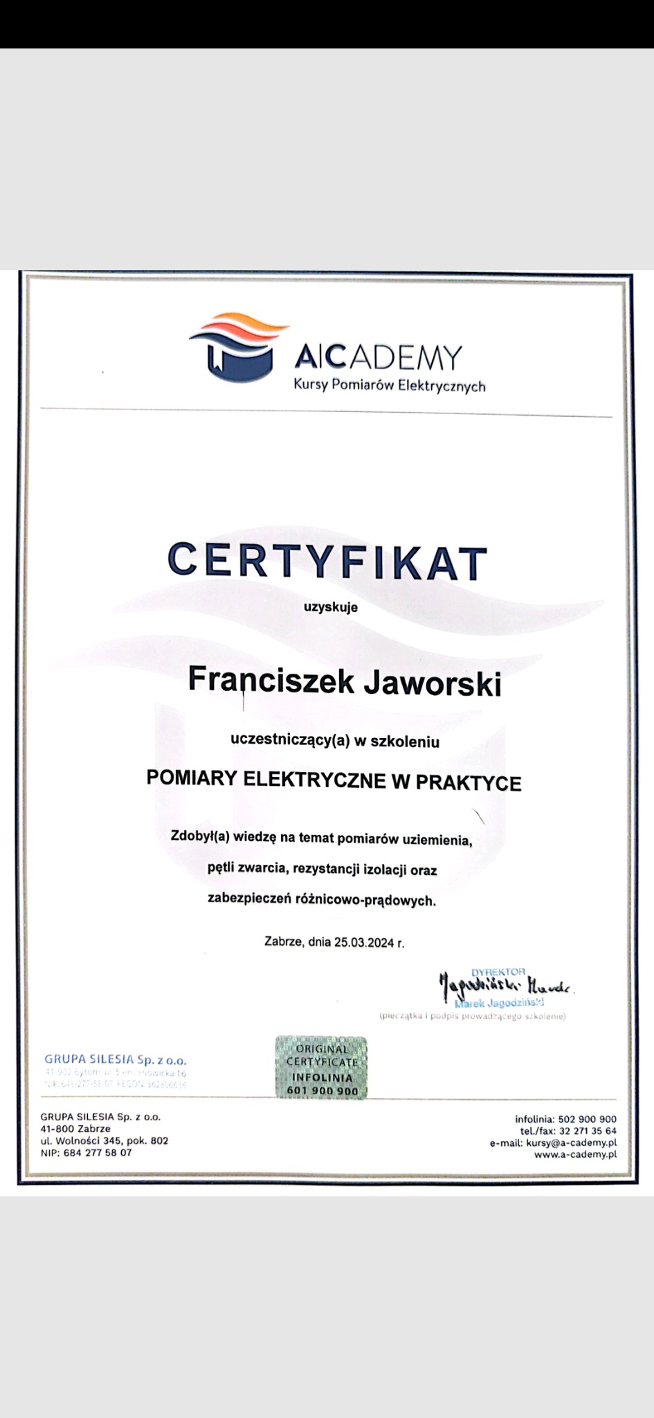 Certyfikat ukończenia szkolenia z pomiarów elektrycznych dla Franciszka Jaworskiego, wydany 25.03.2024 w Zabrzu przez AICADEMY. Zawiera pieczęć i podpis dyrektora.