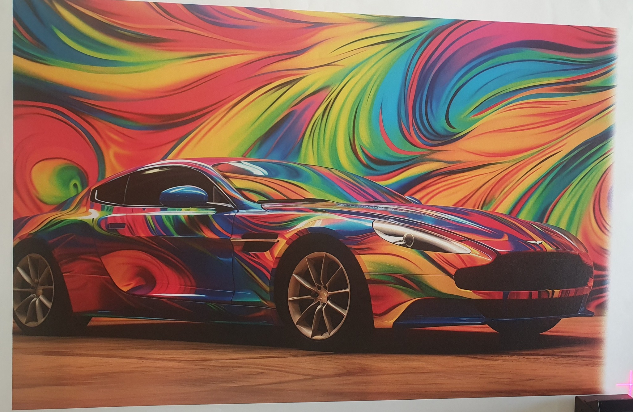 Kolorowy, sportowy samochód z abstrakcyjnym tłem w odcieniach tęczy. Unikalna grafika z efektem malowania na karoserii i dynamicznym tłem.