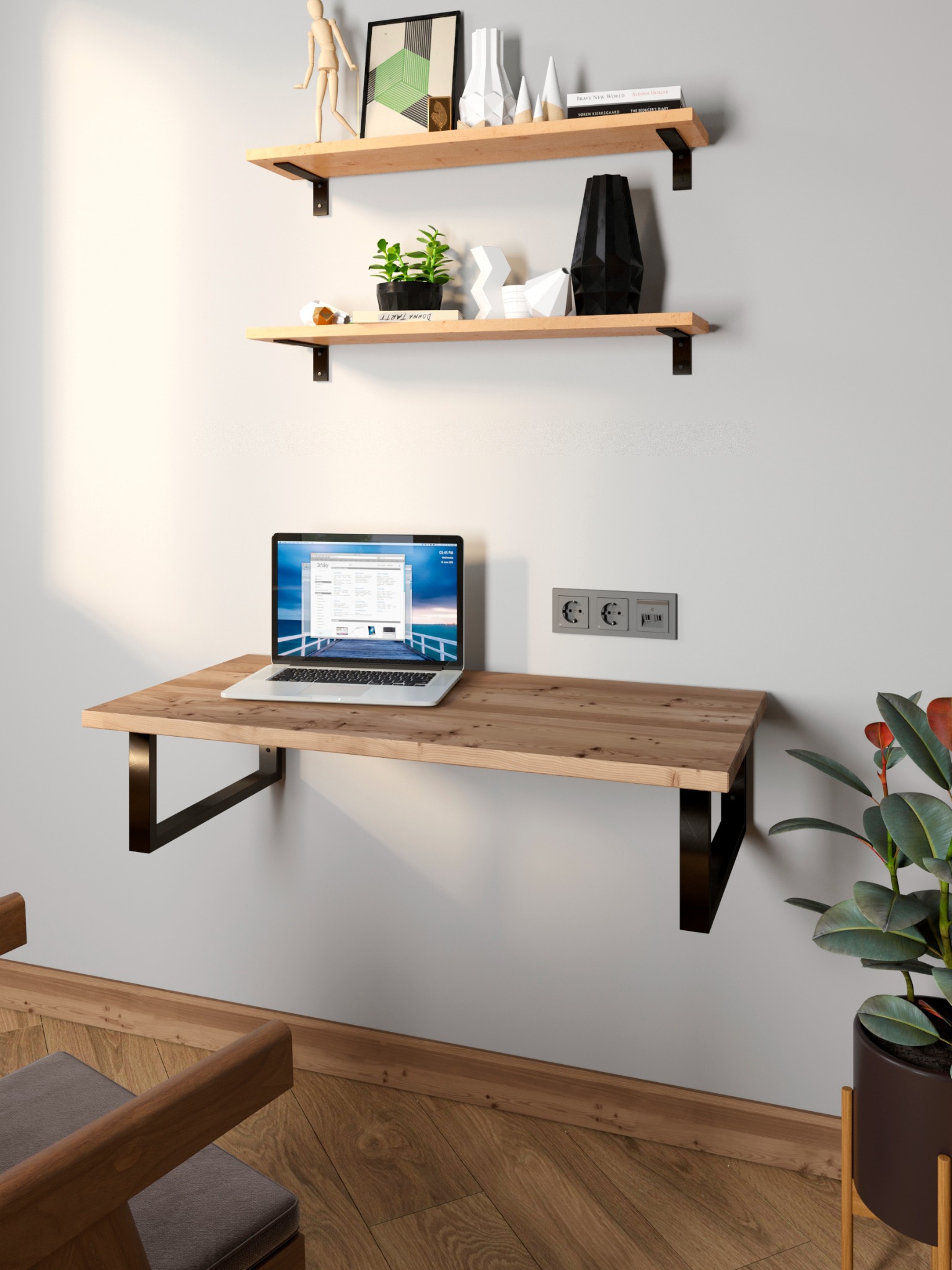 Drewniane biurko przymocowane do ściany z laptopem, nad nim półki z dekoracjami. Nowoczesne wnętrze w Jędrzejowie. Minimalistyczny design, ciepłe oświetlenie.