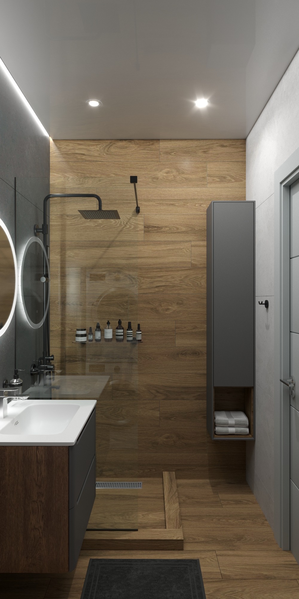 Nowoczesna łazienka z drewnopodobnymi płytkami, czarną armaturą i okrągłymi lustrami z podświetleniem LED. Minimalistyczny design z szarą szafką i odpływem liniowym.
