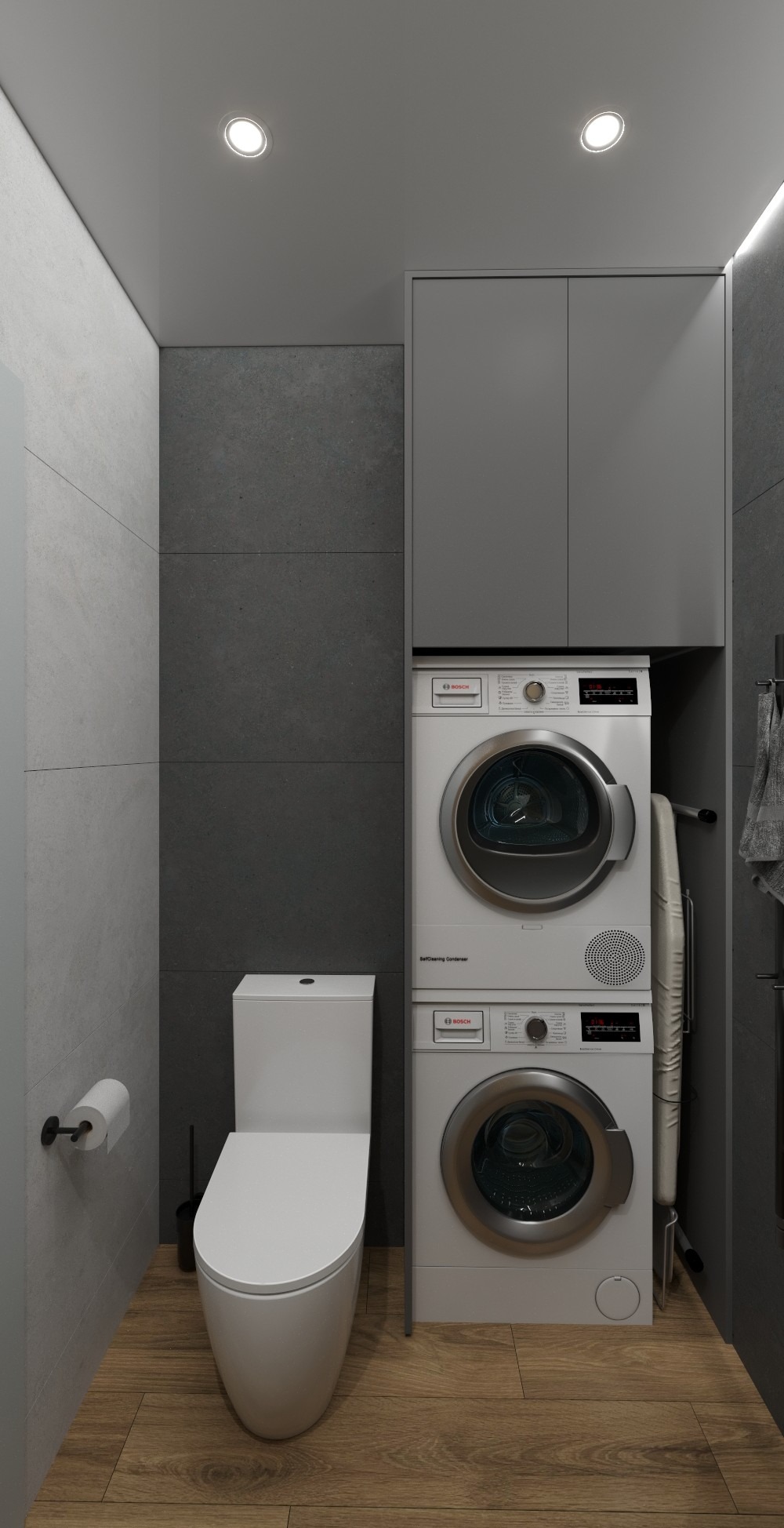 Nowoczesna łazienka z pralką i suszarką w zabudowie, szare płytki, drewnopodobna podłoga i minimalistyczna toaleta. Oświetlenie punktowe.