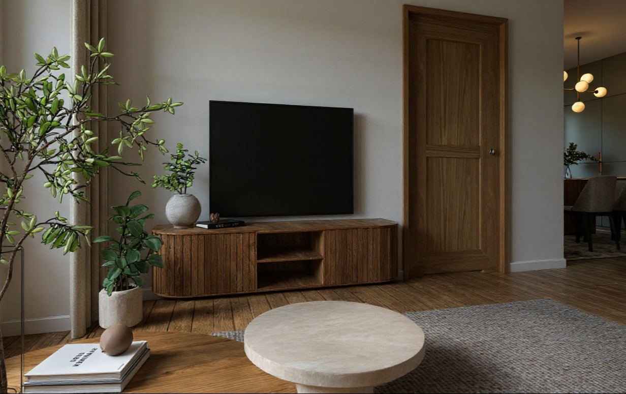 Salon w stylu Japandi: szafka RTV z rattanem, okrągły stolik kawowy, rośliny doniczkowe. Naturalne materiały i stonowana kolorystyka tworzą przytulną atmosferę.