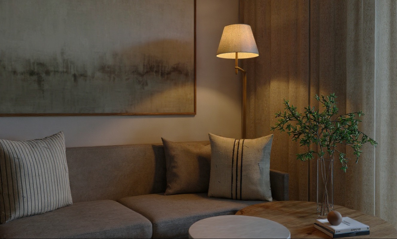 Neutralna aranżacja salonu: beżowa sofa z poduszkami, abstrakcyjny obraz, lampa podłogowa i stolik z zielonymi gałązkami w wazonie. Ciepłe, stonowane oświetlenie.