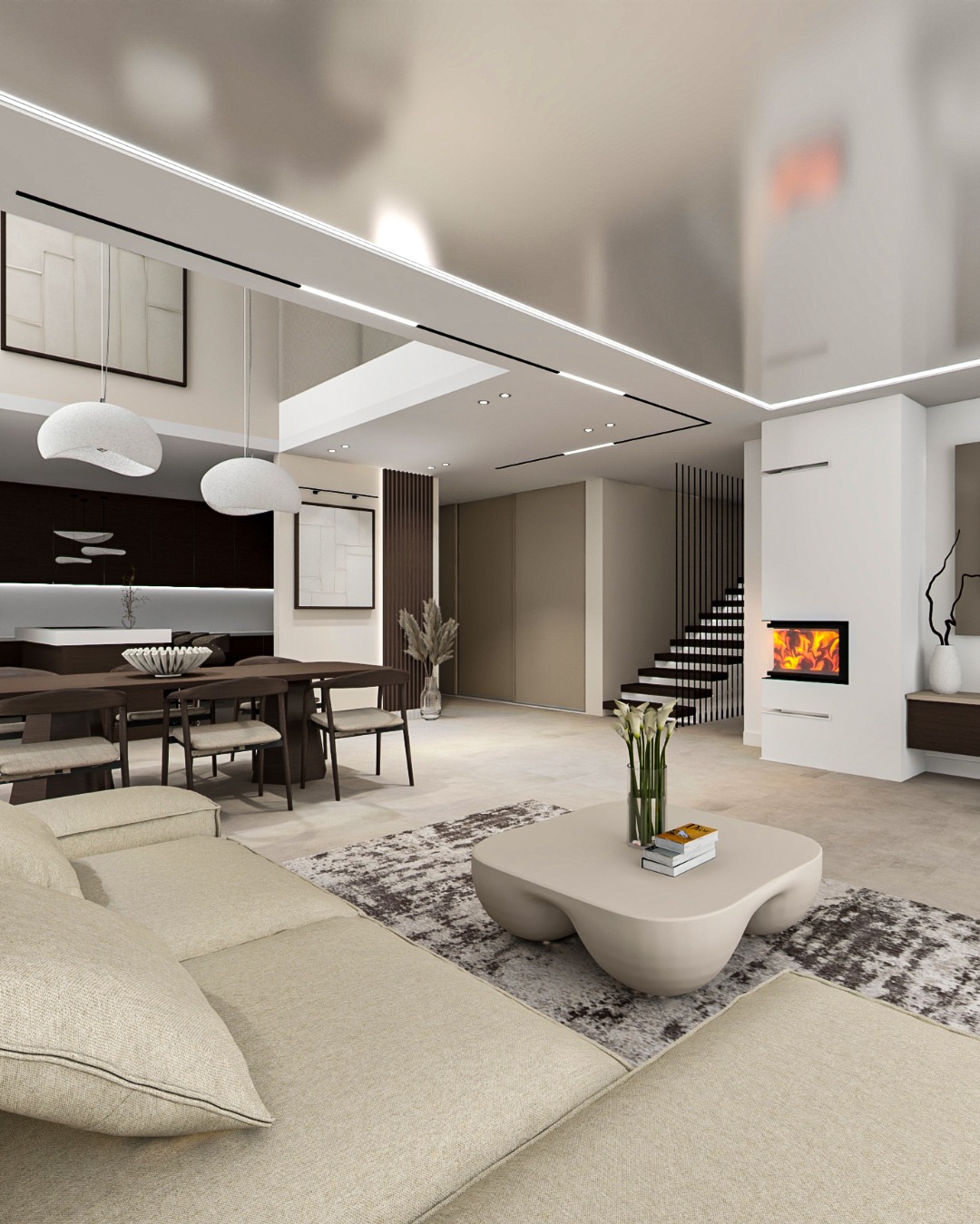 Nowoczesny salon z kominkiem, beżową sofą i stołem. Minimalistyczne lampy wiszące nad stołem. Schody z czarną balustradą w tle. Ciepłe oświetlenie.