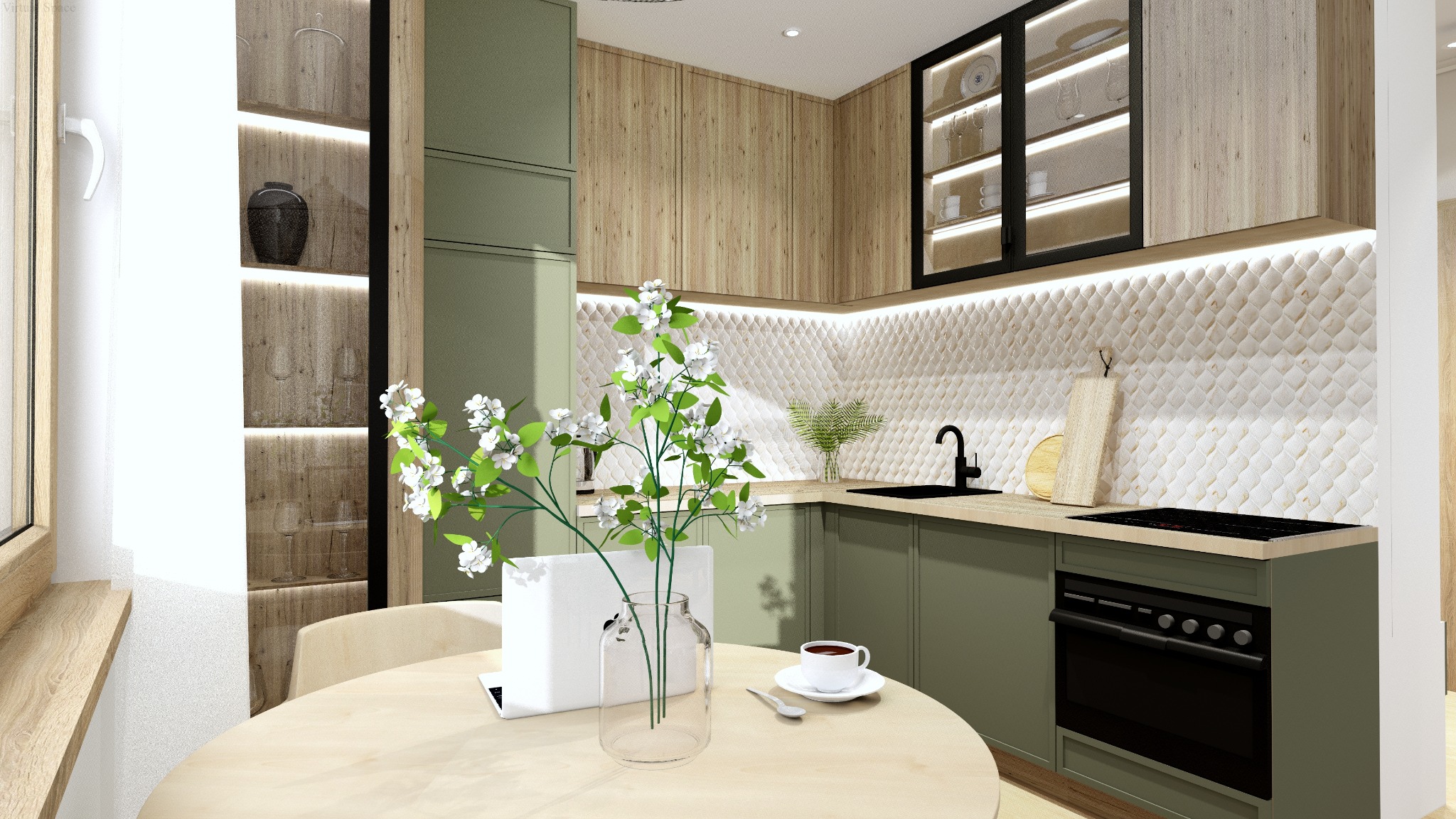 Nowoczesna kuchnia w odcieniach zieleni i drewna, z dekoracyjną mozaiką na ścianie i kwiatami na stole. Widoczny laptop i filiżanka kawy, sugerujące funkcjonalność i estetykę.