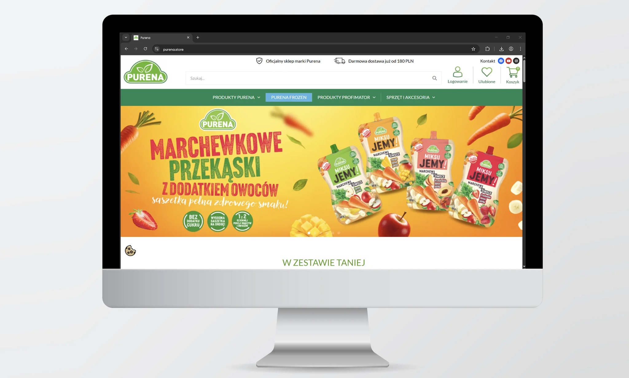 Monitor wyświetla stronę internetową Purena z marchewkowymi przekąskami w saszetkach. Żywe kolory i apetyczne owoce zachęcają do zakupu. Promocja 'W zestawie taniej'.