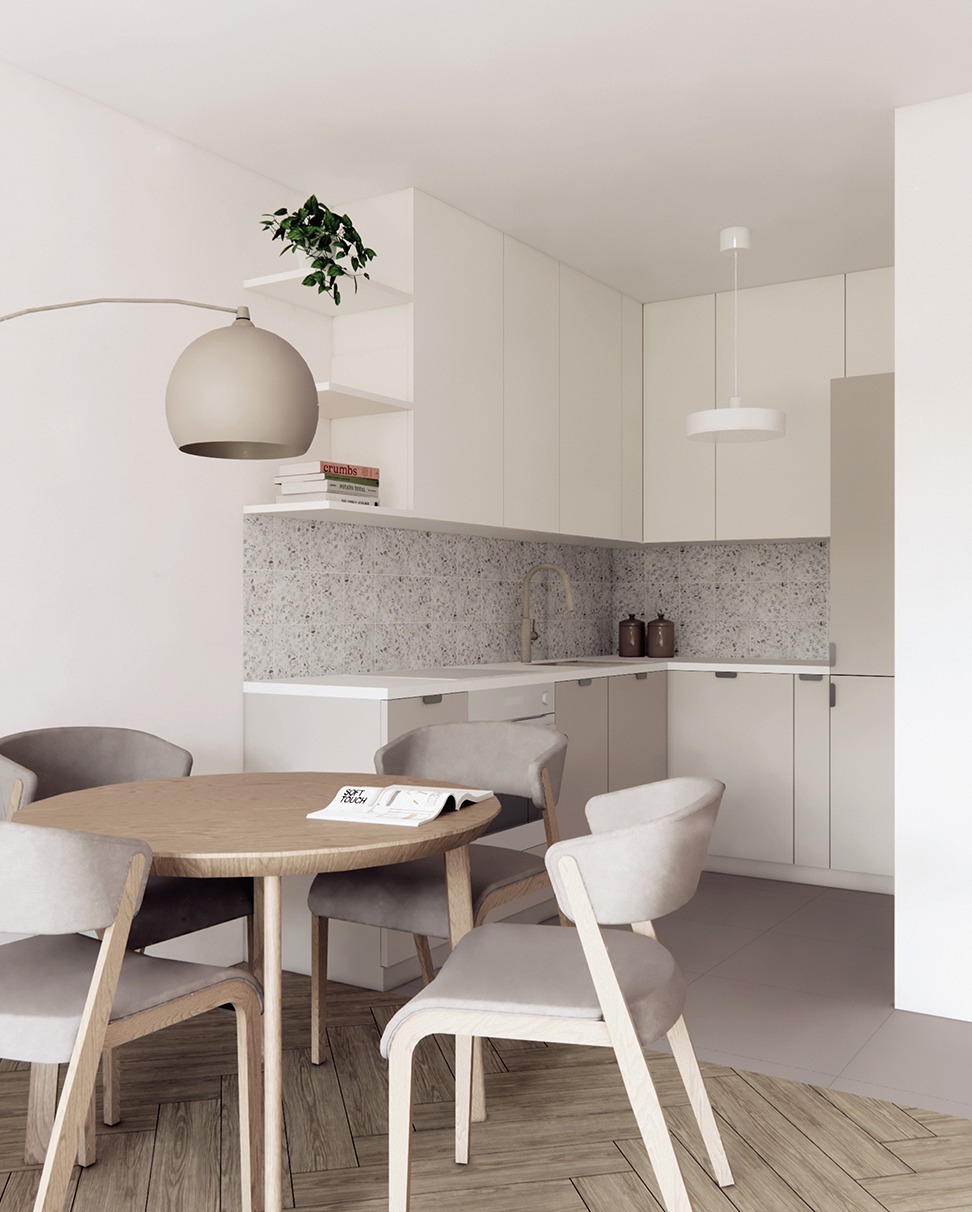 Jasna kuchnia z okrągłym stołem i krzesłami w neutralnych barwach. Minimalistyczny design z rośliną na półce. Projektowanie wnętrz we Wrocławiu.