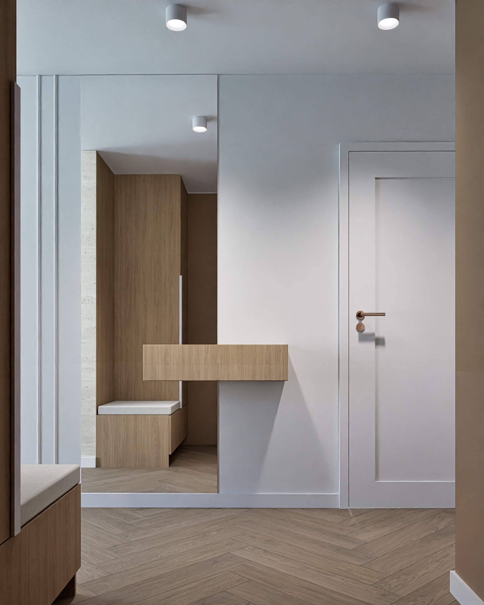 Nowoczesny przedpokój z lustrem, drewnianą zabudową i parkietem w jodełkę. Minimalistyczny design, stonowana kolorystyka, punktowe oświetlenie sufitowe.