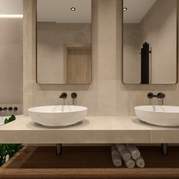 Marmoris Design - Beżowa łazienka z dwoma umywalkami nablatowymi, lustrami w cienkich ramach i minimalistyczną armaturą. Pod umywalkami drewniana półka z ręcznikami.
