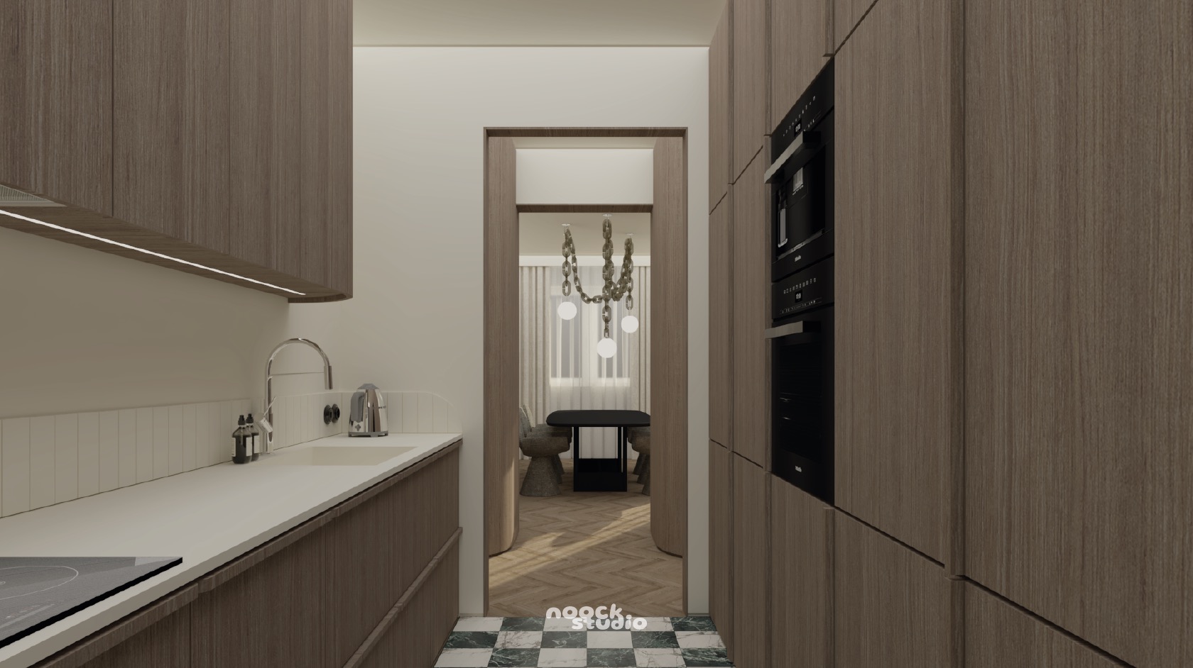 Wnętrze kuchni z drewnianymi szafkami, białym blatem i widokiem na jadalnię z designerskim żyrandolem. Podłoga w szachownicę dodaje charakteru.