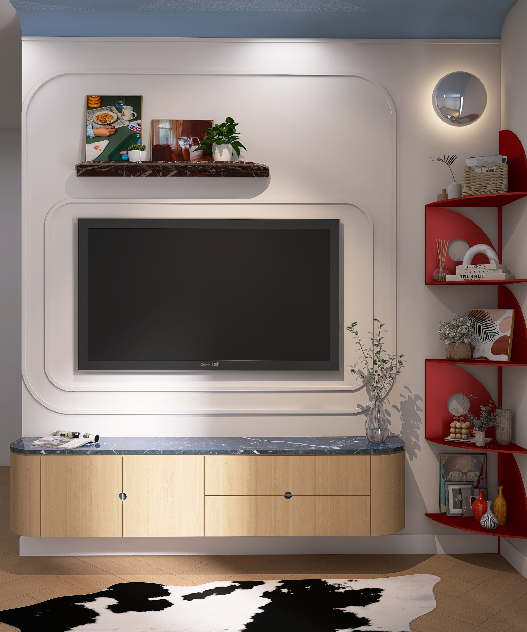Nowoczesny salon z telewizorem w obudowie z półkami i szafką RTV z marmurowym blatem. Czerwone półki narożne z dekoracjami. Na podłodze dywan w krowie łaty.