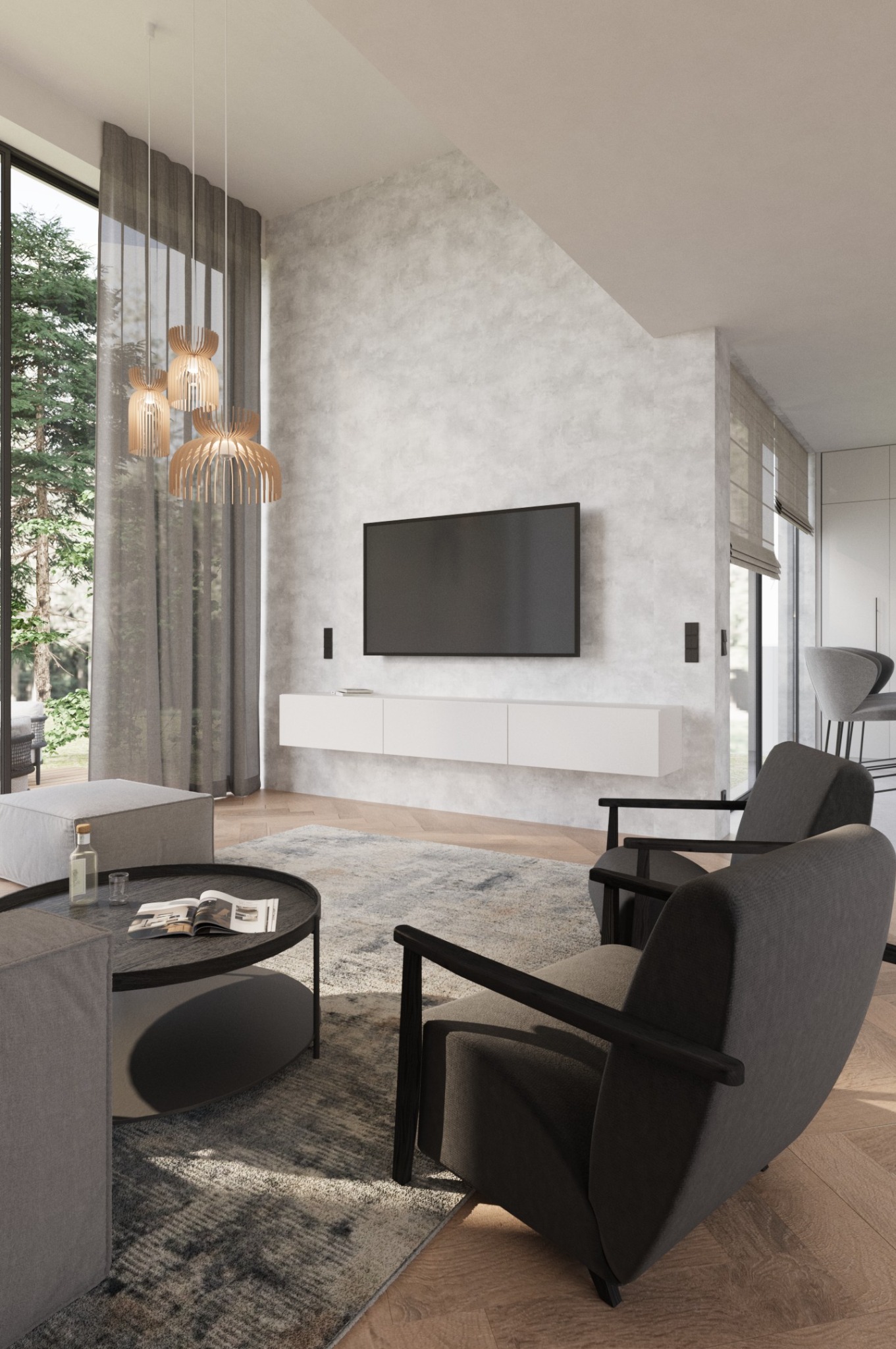 Jasne wnętrze salonu z szarą sofą, dywanem i drewnianą podłogą. Na ścianie wisi telewizor nad białą szafką. Okno z widokiem na zieleń. Designerskie lampy wiszące.