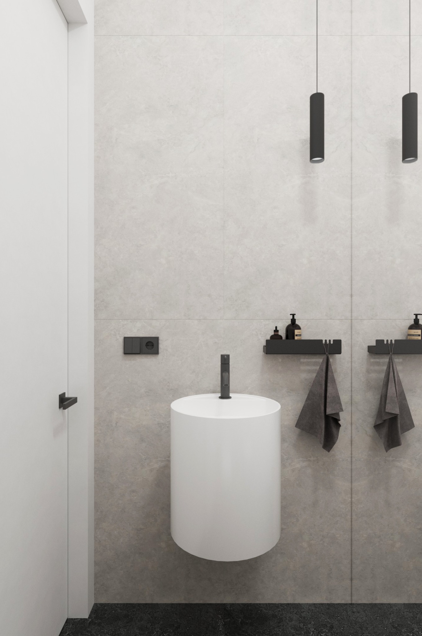 Minimalistyczna łazienka: biała, cylindryczna umywalka, szare płytki, czarne akcenty (armatura, oświetlenie, półki). Nowoczesny design z dbałością o detale.