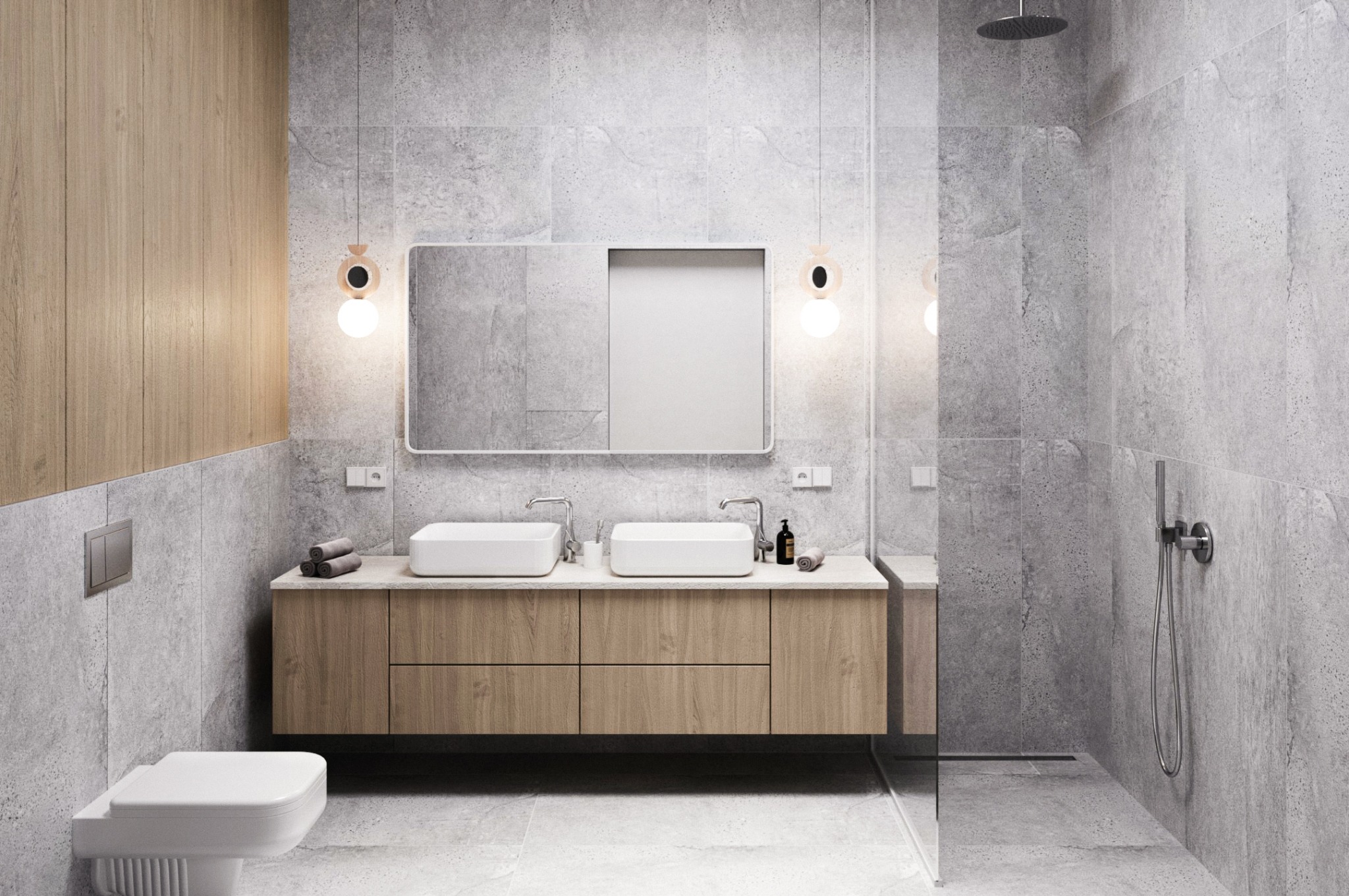 Nowoczesna łazienka z szarymi płytkami, drewnianą szafką pod umywalkami i okrągłymi lampami wiszącymi. Minimalistyczny design z toaletą i kabiną prysznicową.