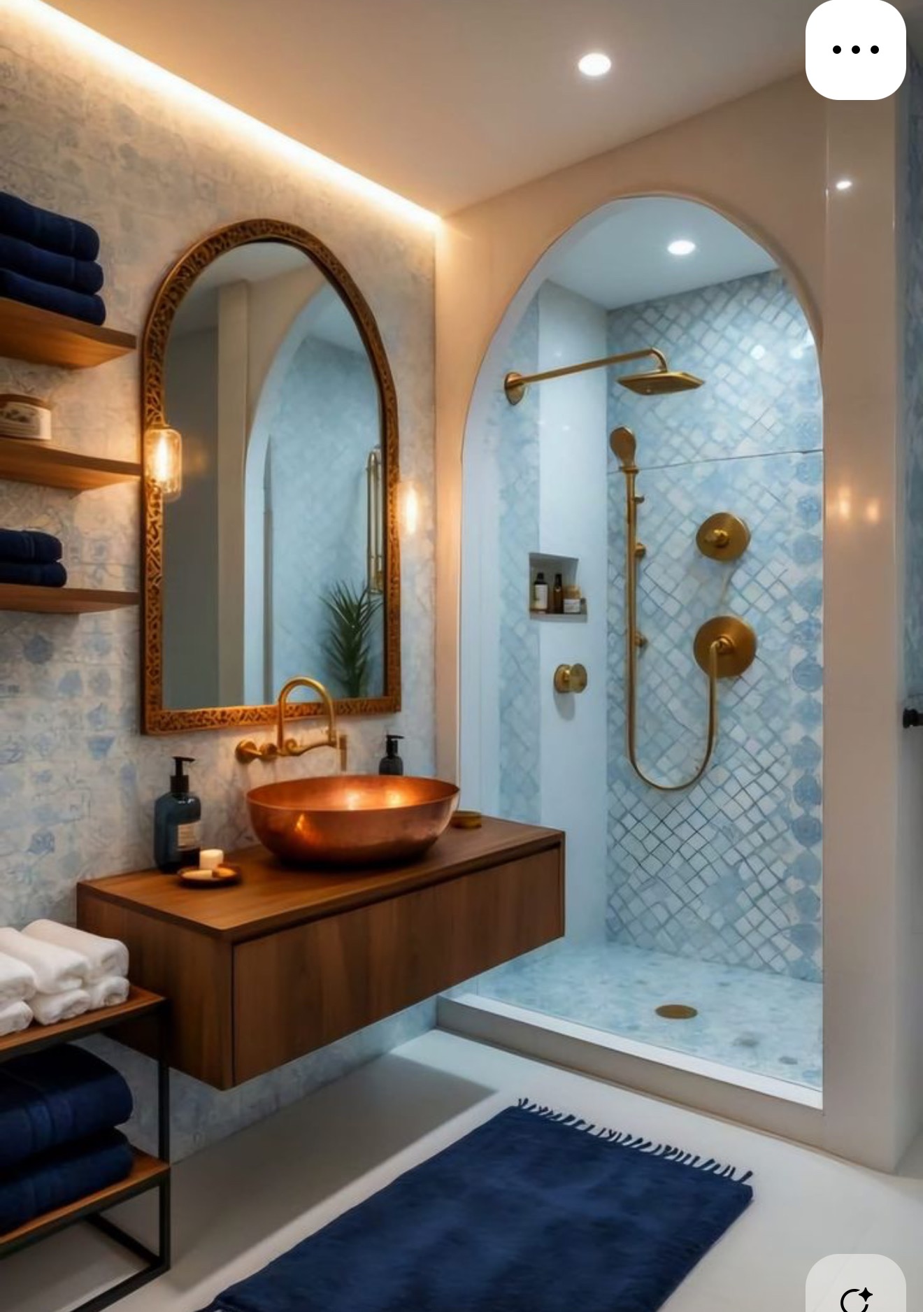 Nowoczesna łazienka z miedzianą umywalką, drewnianą szafką i kabiną prysznicową w stylu arabskim. Lustro w złotej ramie i niebieskie ręczniki dodają elegancji.