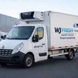 Wiktor Wrzodak - Biały samochód dostawczy Renault z chłodnią, z logo WJ Fresh-Trans, zaparkowany na zewnątrz. Widoczny numer telefonu i napis 'Transport nowej generacji'.