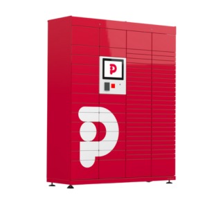 Czerwony lunchomat z ekranem dotykowym i logo firmy, ustawiony na białym tle. Widok z przodu, lekko z boku, prezentujący automat do wydawania posiłków.