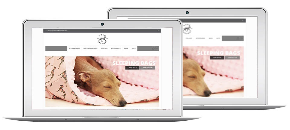 Dwa laptopy z otwartą stroną gonewiththehound.com, prezentującą śpiącego psa w legowisku. Widoczny minimalistyczny design i oferta 'Sleeping Bags'.