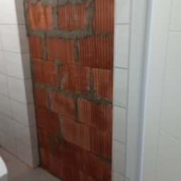 Wymurowanie ( kotwienie co drugi pustak w ścianie szpilkami ) 